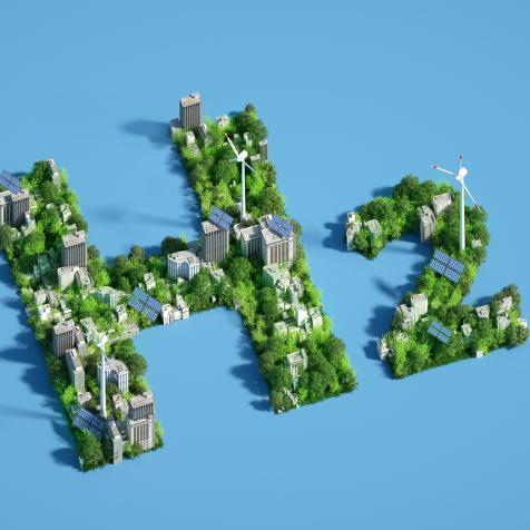 Digital generated image of H2 hydrogen icon made out of green sustainable city with wind turbines and solar panels  on blue background.